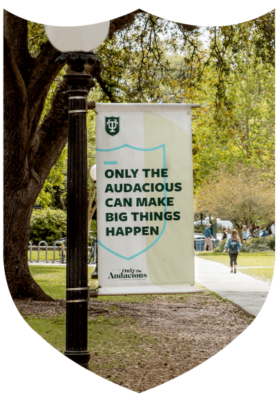 A banner on a signpost on the Tulane University campus that reads, "Only the audacious can make big things happen"